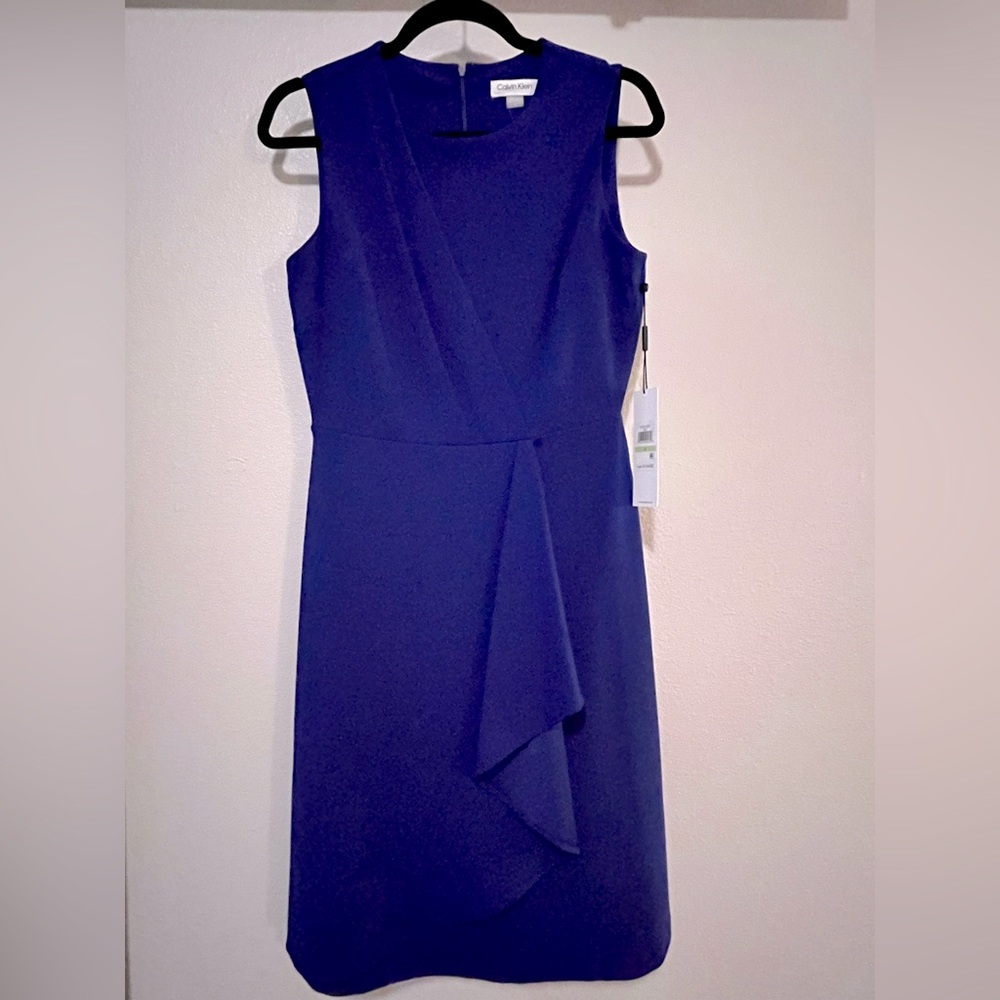 New with tags!! Calvin Klein dress. Size 4. Beautiful blue sleeveless dress!